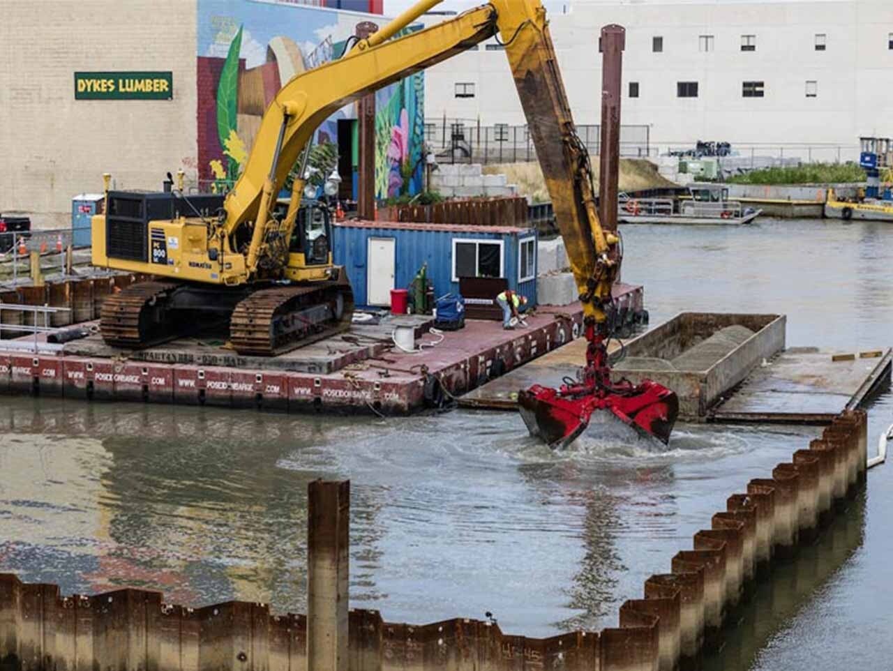 Excavating contaminated sediment at the 4th Street Turning Basin for transfer to the sludge treatment yard - Gowanus Canal, NYC.